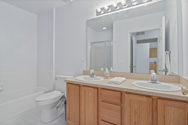 full bathroom with tile patterned flooring, vanity, shower with separate bathtub, and toilet