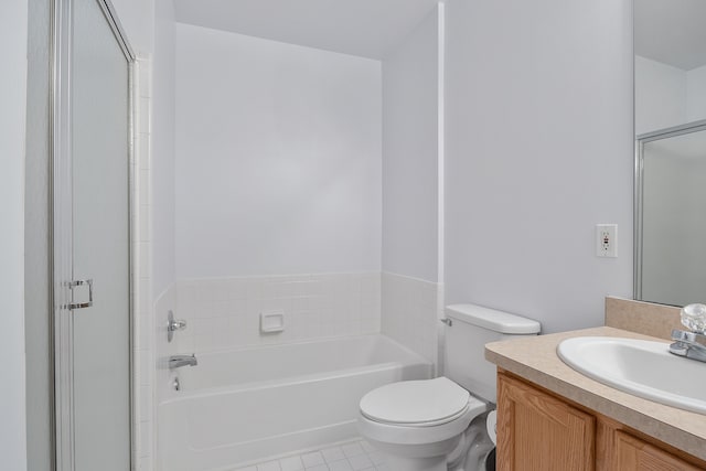 bathroom featuring tile patterned floors, vanity, a tub to relax in, and toilet