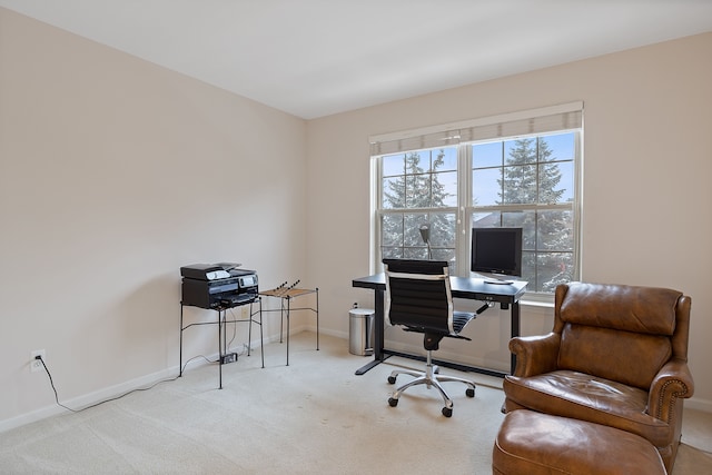 office area featuring light colored carpet