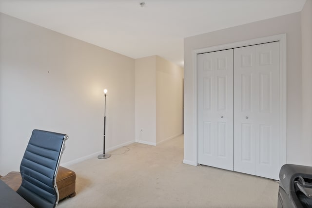 living area with light colored carpet