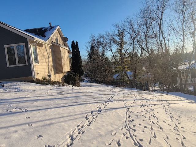 view of yard layered in snow