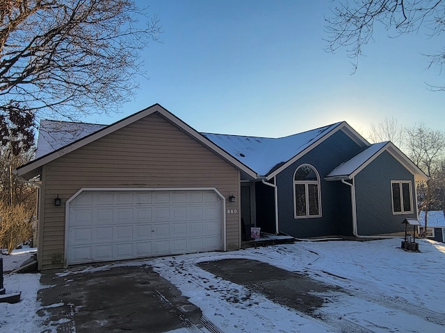 ranch-style house featuring a garage