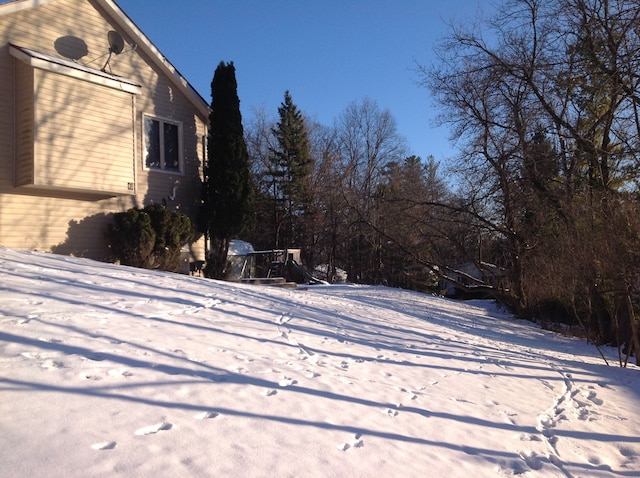 view of yard layered in snow