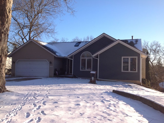 single story home featuring a garage