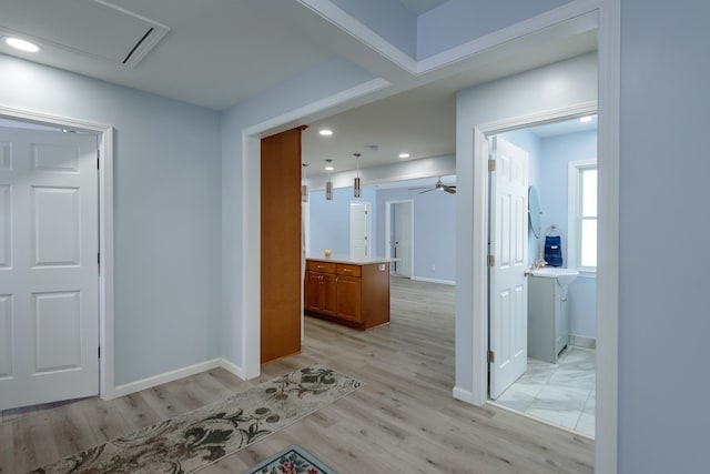 hall with light hardwood / wood-style flooring