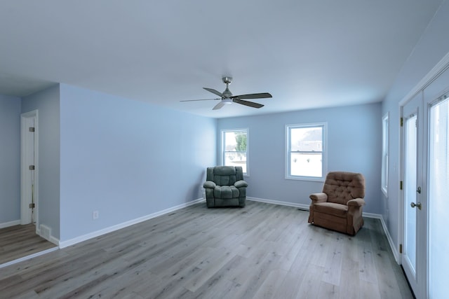 unfurnished room with ceiling fan and light hardwood / wood-style flooring