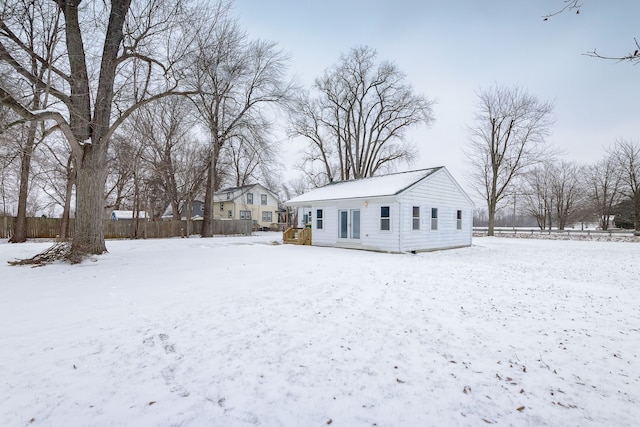 view of snow covered house