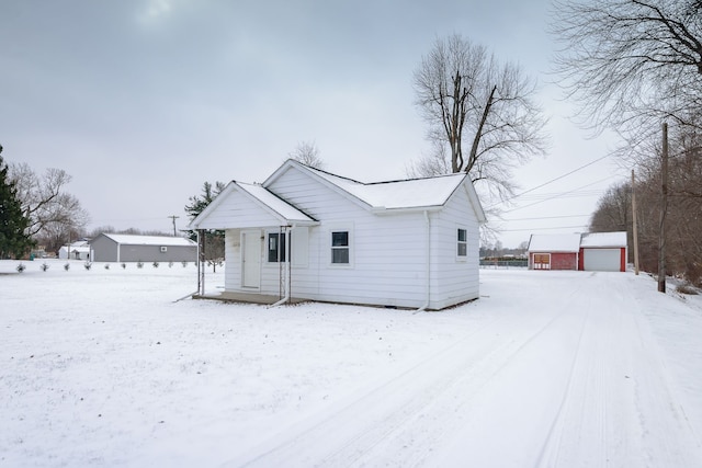 view of front of property with an outbuilding and a garage