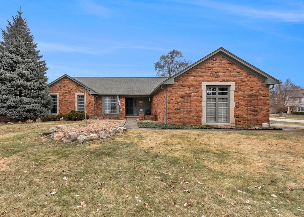 ranch-style house with a front yard