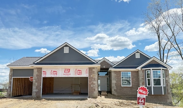 837 Preserve Ln, White Lake, MI 48386 - view of front facade with brick siding and an attached garage