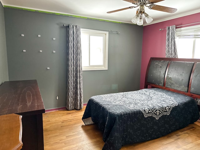 bedroom with hardwood / wood-style flooring and ceiling fan