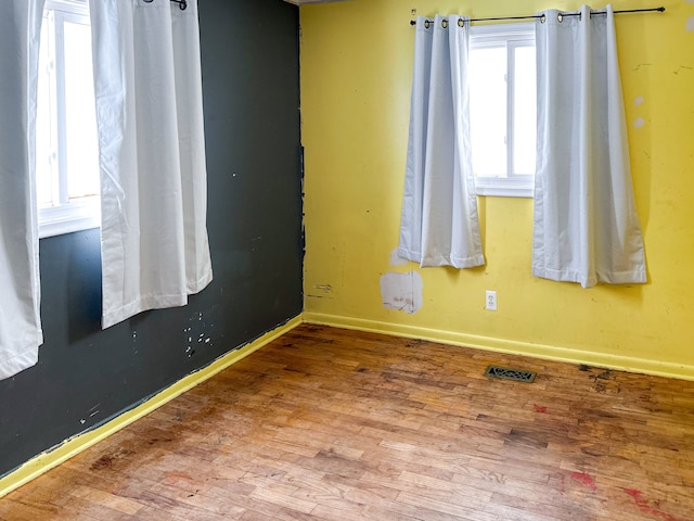 empty room featuring hardwood / wood-style flooring