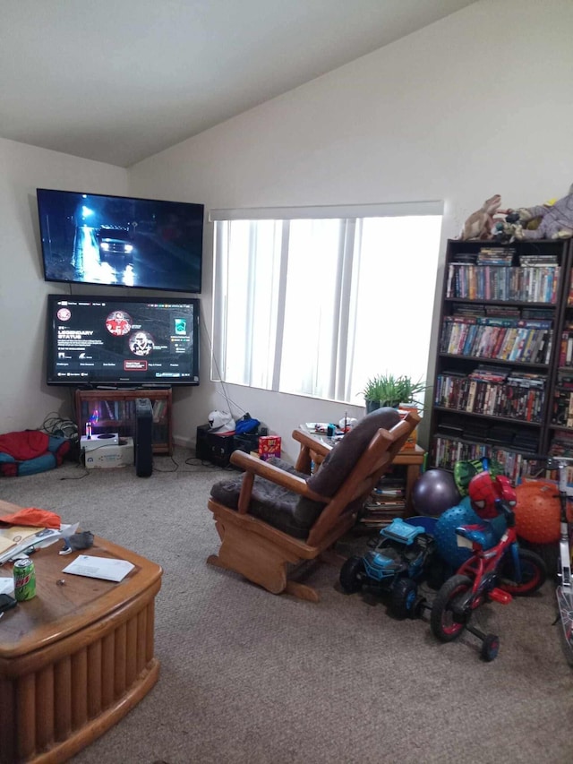 carpeted living room with lofted ceiling