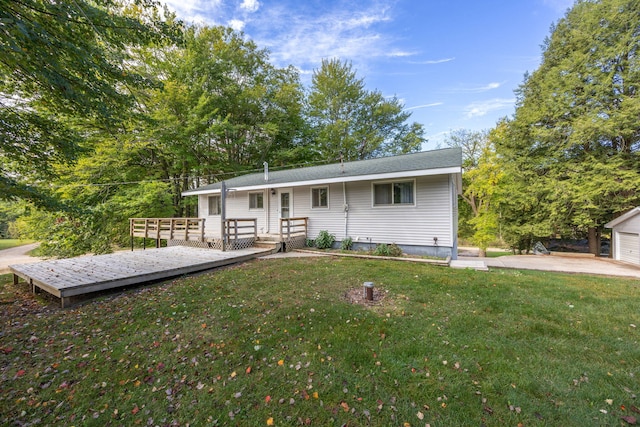 back of house with a yard and a wooden deck