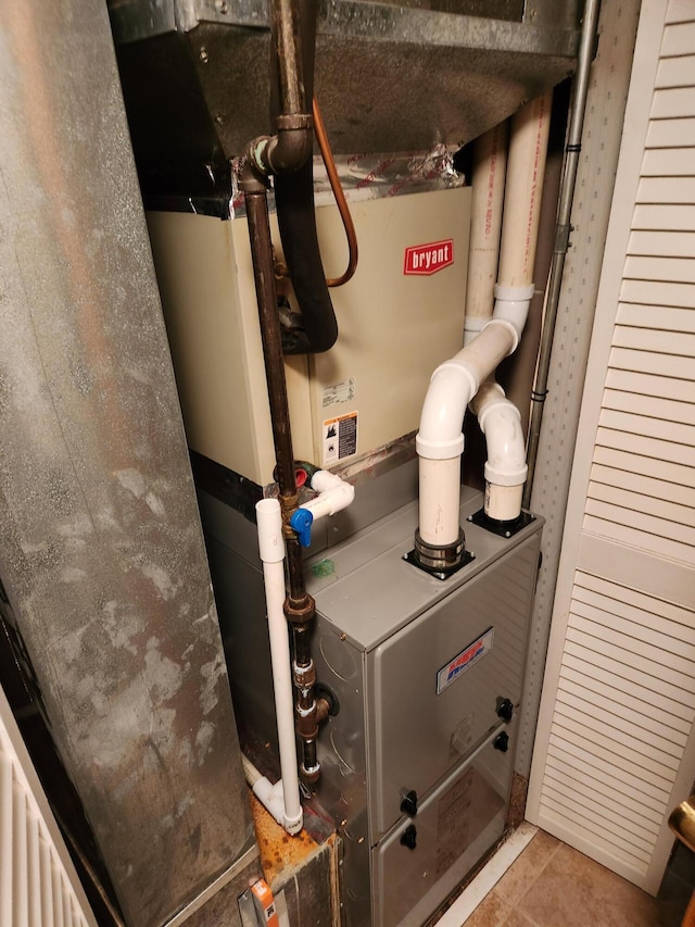 utility room with heating unit