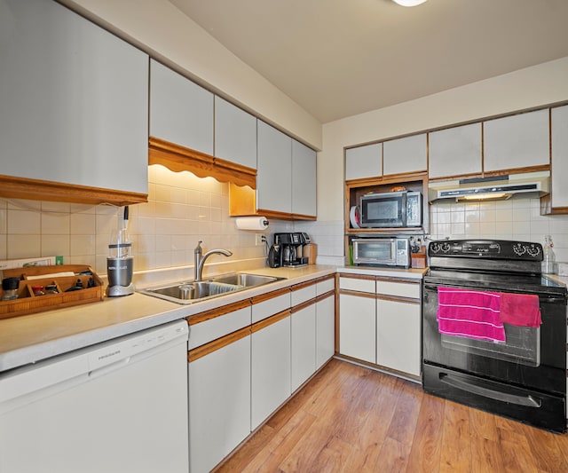 kitchen with white dishwasher, sink, white cabinetry, light hardwood / wood-style flooring, and black electric range oven