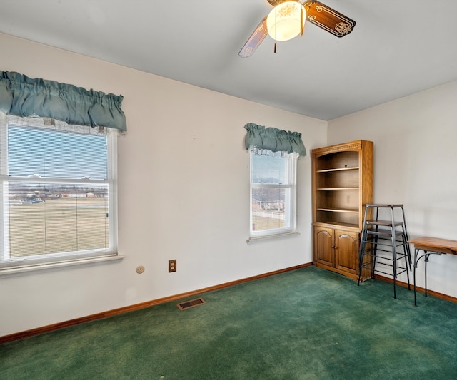 interior space featuring ceiling fan