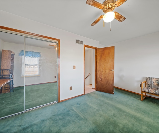 bedroom with ceiling fan, carpet floors, and a closet