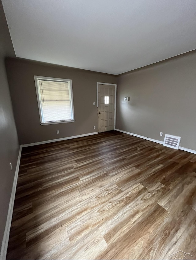 foyer entrance with hardwood / wood-style floors