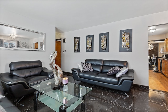 living room featuring a notable chandelier