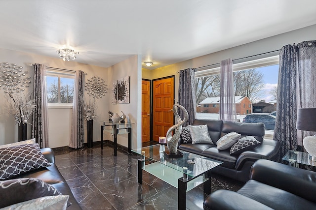 living room with a notable chandelier