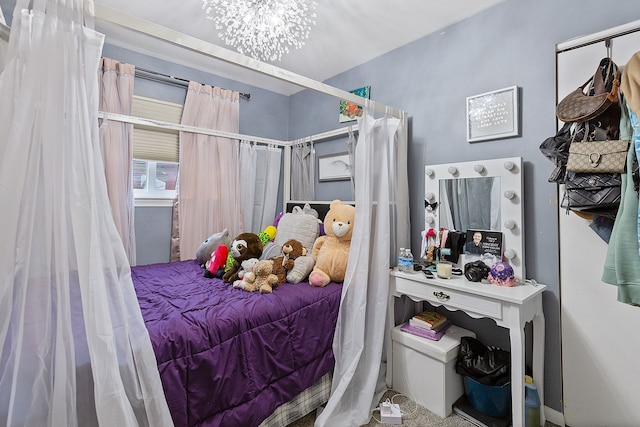 bedroom featuring a notable chandelier