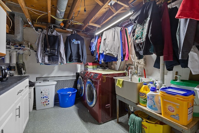 clothes washing area featuring sink and washing machine and dryer