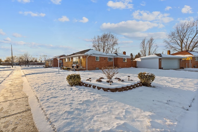 view of front of property featuring a garage and an outbuilding