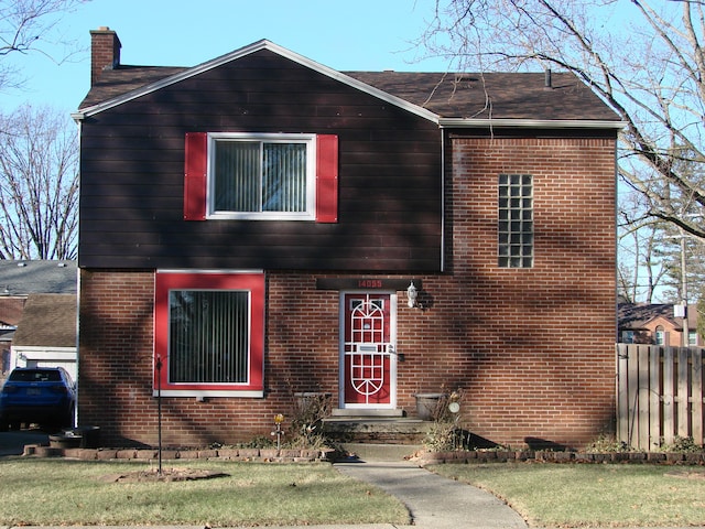 view of front of house with a front lawn