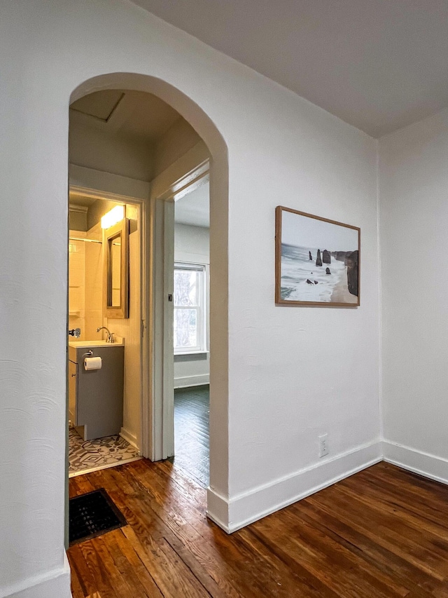 corridor featuring dark hardwood / wood-style flooring