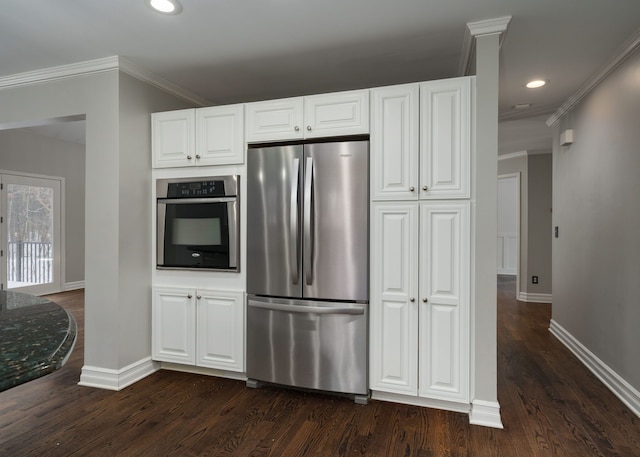 kitchen with crown molding, dark wood-type flooring, white cabinets, and stainless steel appliances