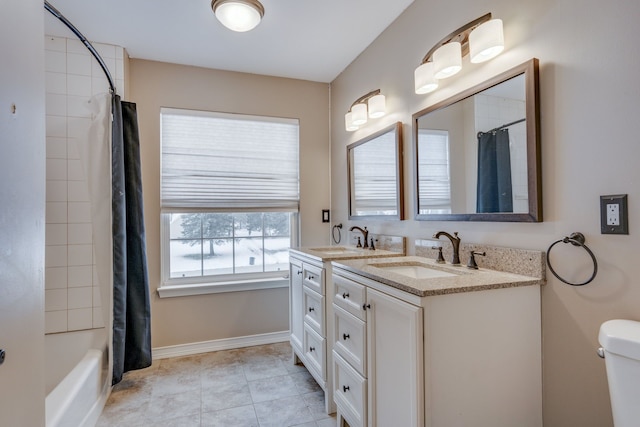 full bathroom featuring shower / tub combo, vanity, and toilet