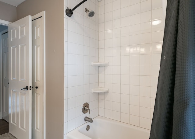 bathroom featuring shower / bathtub combination with curtain