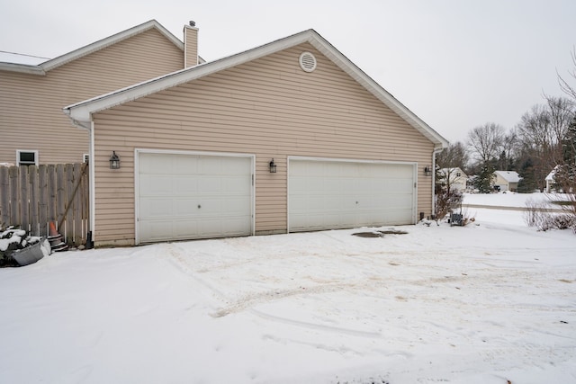 view of snow covered garage