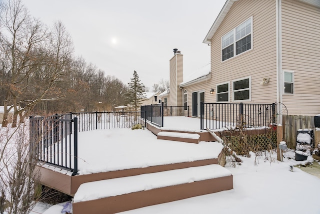 view of snow covered deck