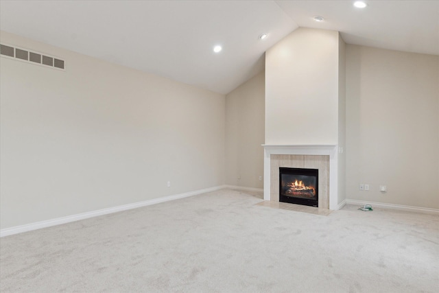 unfurnished living room with a tile fireplace, recessed lighting, visible vents, baseboards, and carpet