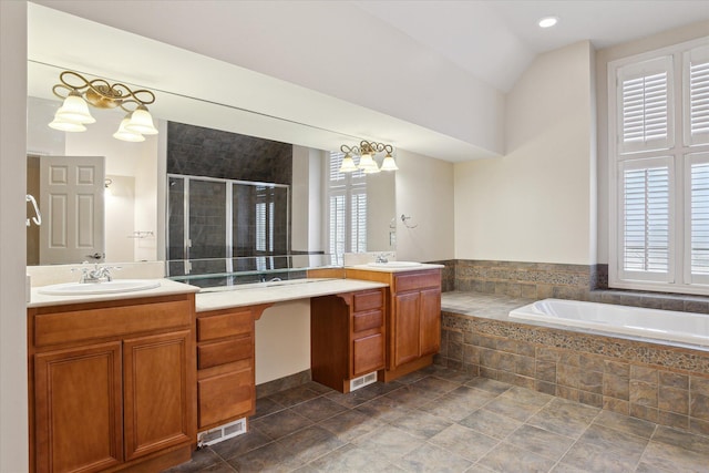 bathroom featuring a garden tub, two vanities, visible vents, a stall shower, and a sink