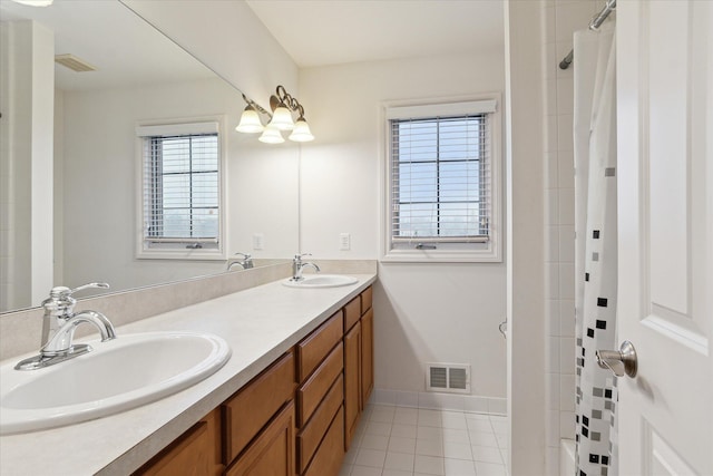 bathroom with tile patterned floors, visible vents, a sink, and a shower with shower curtain