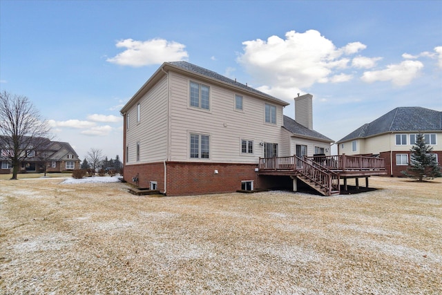 rear view of house featuring brick siding, a chimney, central AC unit, and a wooden deck