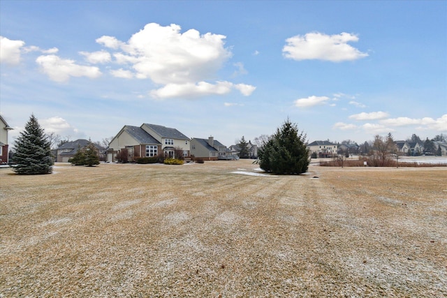 view of yard featuring a residential view