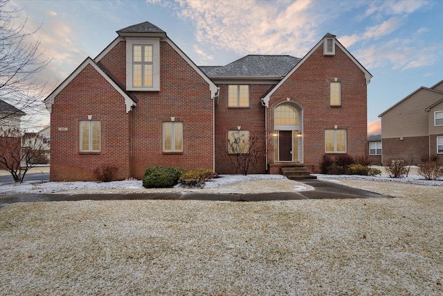 traditional-style house with brick siding