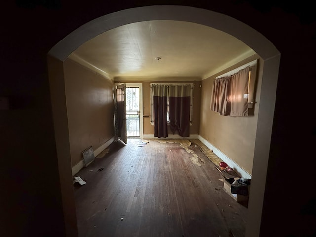 corridor with hardwood / wood-style floors