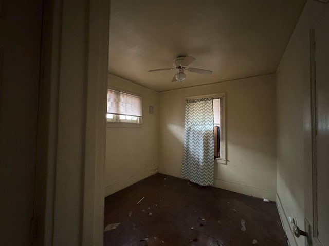 unfurnished room with ceiling fan