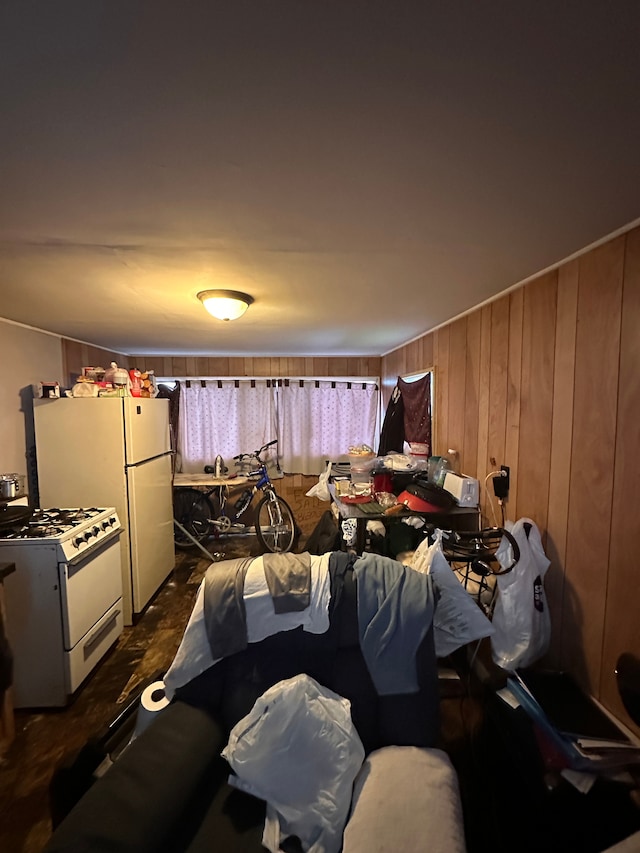 bedroom with white fridge and wooden walls