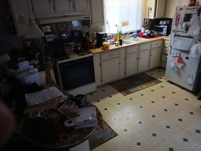 kitchen with sink and white appliances