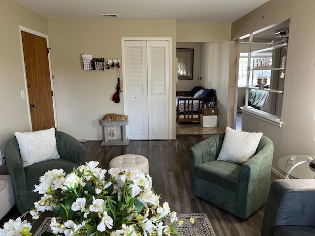 living room featuring dark wood-type flooring