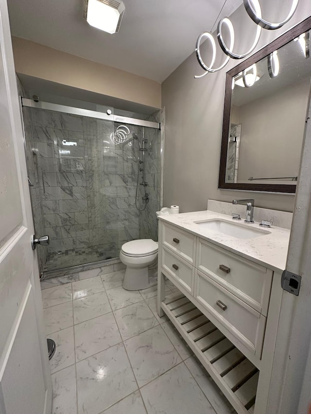 bathroom featuring walk in shower, vanity, and toilet