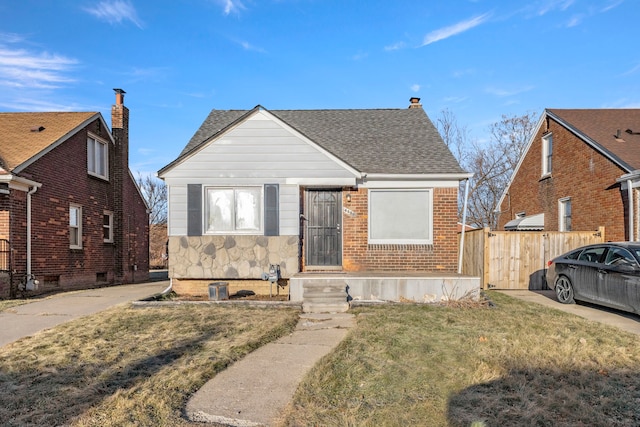 bungalow-style house featuring a front yard