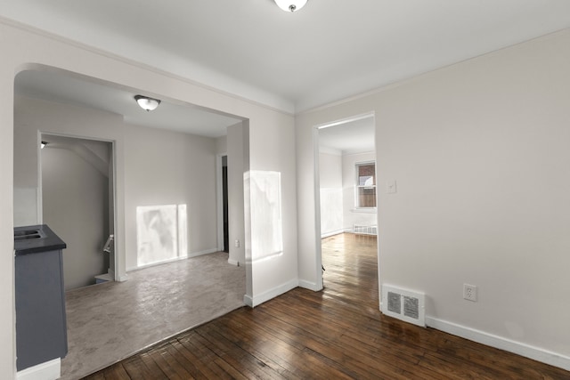 spare room featuring dark hardwood / wood-style flooring