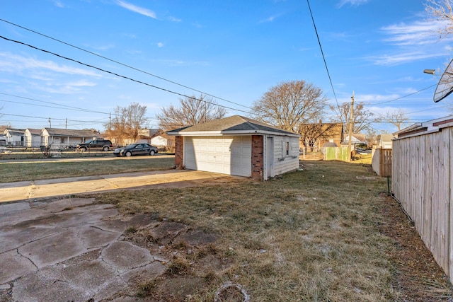 garage featuring a yard